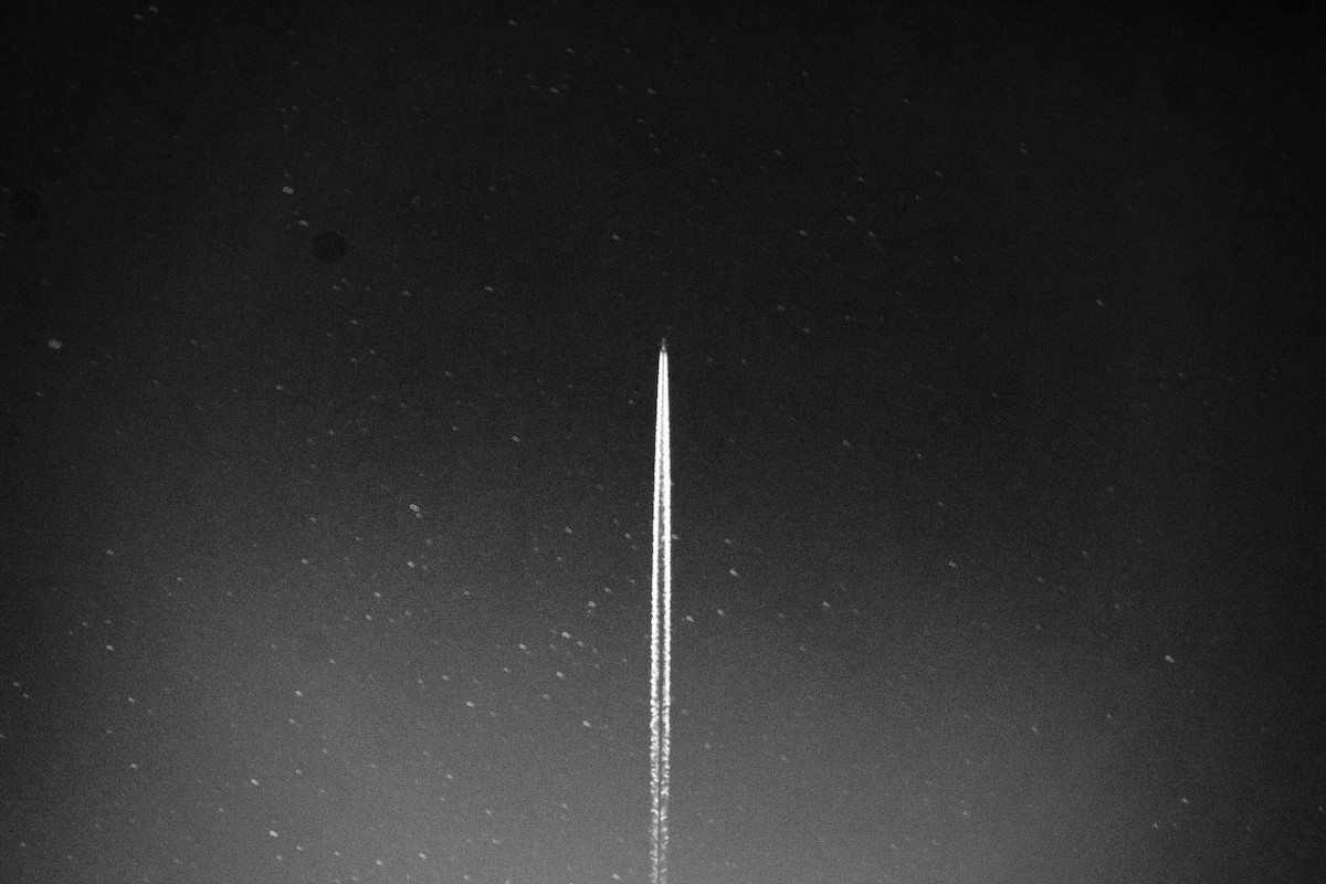 Image of rocket ship soaring through space